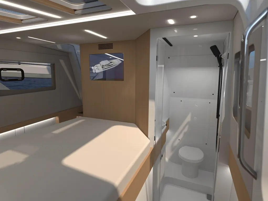 A modern yacht interior featuring a double bed, shower room with toilet, and a wall-mounted boat photo.